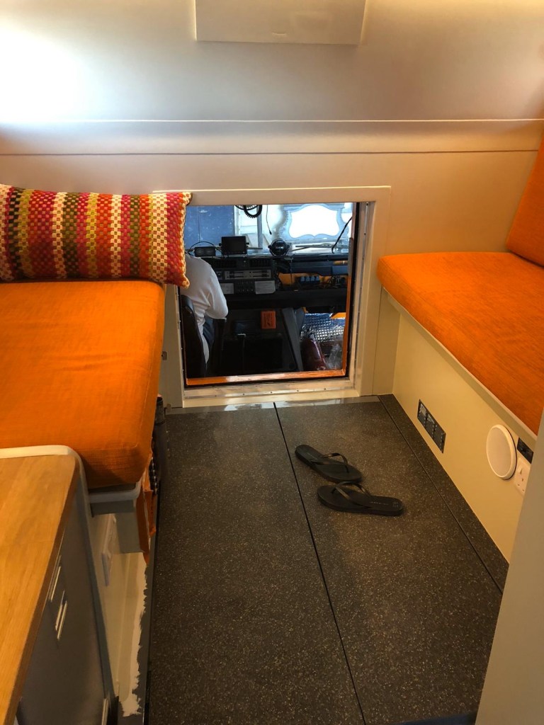 Dining and crawl through to cab