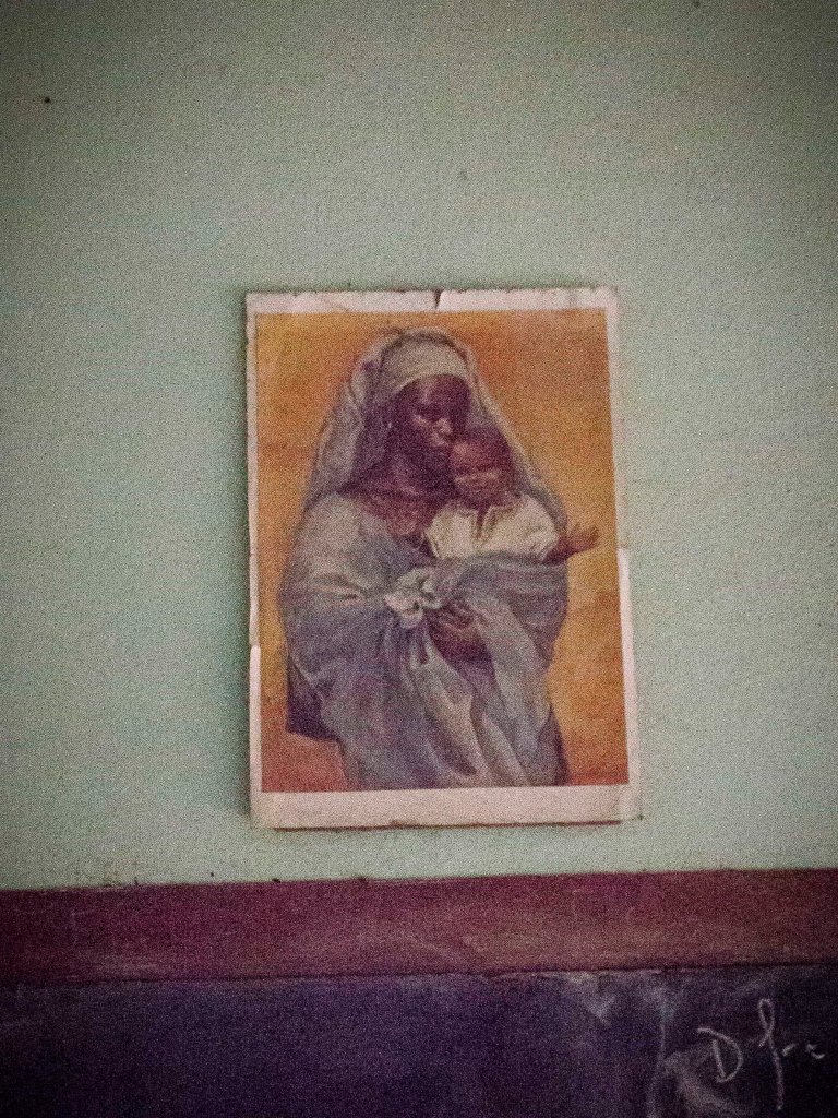 African mother and child at overnight stop at Catholic school