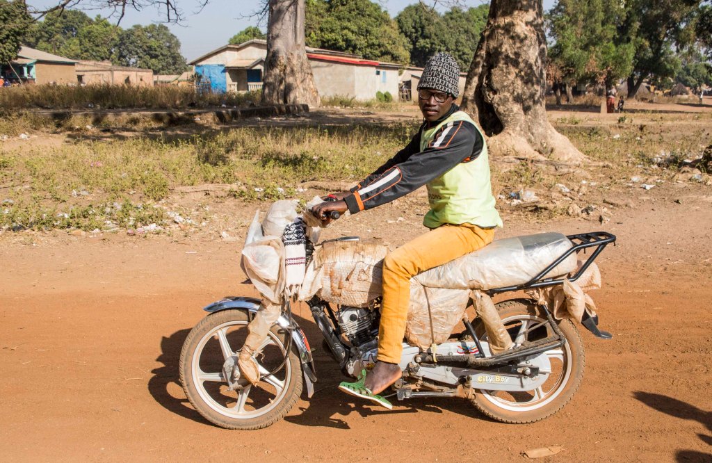Bike protected from damage but driver has no helmet or sensible shoes!