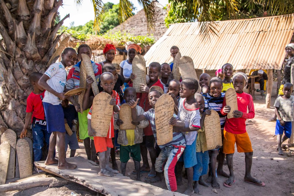 Kids proudly displaying their religious tablets